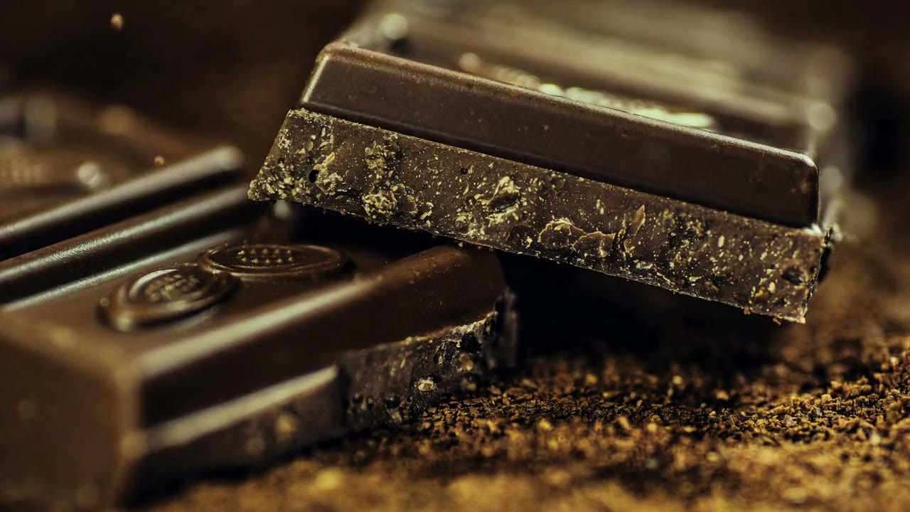 Dark chocolate bars dusted with cocoa powder